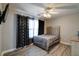 Bedroom featuring a ceiling fan, light walls, and contemporary decor at 10597 Cyrus Dr, Indianapolis, IN 46231