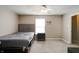 Cozy bedroom with a ceiling fan, window, and closet that provides a comfortable and functional space at 10597 Cyrus Dr, Indianapolis, IN 46231