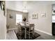 Inviting dining area with modern chandelier and decoratively adorned walls at 10597 Cyrus Dr, Indianapolis, IN 46231