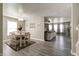 Open-concept dining room featuring modern light fixture and neutral tones at 10597 Cyrus Dr, Indianapolis, IN 46231
