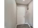 Entryway door leading to the unit and alarm system at 10597 Cyrus Dr, Indianapolis, IN 46231