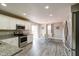 Bright eat-in kitchen featuring stainless steel appliances, granite countertops, and sliding glass doors at 10597 Cyrus Dr, Indianapolis, IN 46231
