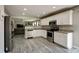 Modern kitchen featuring stainless steel appliances, granite countertops, and neutral walls at 10597 Cyrus Dr, Indianapolis, IN 46231