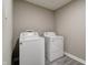 Functional laundry room with modern washer and dryer units, great for everyday convenience at 10597 Cyrus Dr, Indianapolis, IN 46231