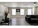 Bright living room featuring hard surface floors and a comfortable sectional sofa at 10597 Cyrus Dr, Indianapolis, IN 46231