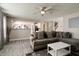 Open-concept living room featuring hardwood floors and seamless access to kitchen at 10597 Cyrus Dr, Indianapolis, IN 46231