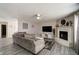 Bright living room featuring a fireplace, modern decor, and hardwood floors at 10597 Cyrus Dr, Indianapolis, IN 46231