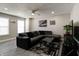 Inviting living room featuring modern gray tones, plush seating, and stylish decor at 10597 Cyrus Dr, Indianapolis, IN 46231