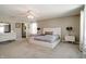 Spacious bedroom boasts plush carpeting, neutral decor, and ample natural light at 10597 Cyrus Dr, Indianapolis, IN 46231