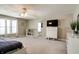 This spacious bedroom is complete with plush carpeting, ensuite, and modern furnishings at 10597 Cyrus Dr, Indianapolis, IN 46231