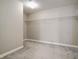Spacious walk-in closet featuring neutral paint and gray carpet, complete with a wire shelving unit at 10597 Cyrus Dr, Indianapolis, IN 46231