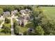 Aerial view of a home featuring a backyard with a play area, firepit, and manicured lawn at 1060 Cape Coral Dr, Cicero, IN 46034