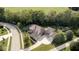 Expansive aerial view showcases the large home with mature trees, private backyard, long driveway and multiple-car garage at 1060 Cape Coral Dr, Cicero, IN 46034
