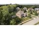 Expansive aerial view showcases a large home with a private backyard, fire pit, play area, and mature trees at 1060 Cape Coral Dr, Cicero, IN 46034