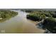 Aerial view of lake with tree-lined shores and multiple boat docks at 1060 Cape Coral Dr, Cicero, IN 46034