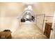 Attic space with carpet, industrial decor, several light fixtures, couch, and desk at 1060 Cape Coral Dr, Cicero, IN 46034