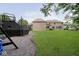 Expansive backyard features a playground, a spacious lawn, and a charming brick exterior at 1060 Cape Coral Dr, Cicero, IN 46034