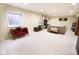 Large finished basement with ample seating, lots of light, and workout area at 1060 Cape Coral Dr, Cicero, IN 46034