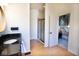 Open bathroom with granite-topped vanity, walk-in shower, and view into the main bedroom at 1060 Cape Coral Dr, Cicero, IN 46034
