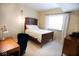 Comfortable bedroom with a wooden bed frame and classic desk at 1060 Cape Coral Dr, Cicero, IN 46034