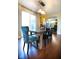 Bright dining room featuring a wooden table with upholstered chairs and sliding glass doors for natural light at 1060 Cape Coral Dr, Cicero, IN 46034