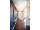 Inviting entryway with hardwood floors, modern chandelier, console table, and eye-catching wall art at 1060 Cape Coral Dr, Cicero, IN 46034