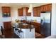Well-equipped kitchen features a large center island, stainless steel appliances, granite countertops, and ample cabinet space at 1060 Cape Coral Dr, Cicero, IN 46034