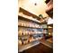 Organized pantry with wooden shelves and white baskets with labels for efficient storage at 1060 Cape Coral Dr, Cicero, IN 46034