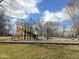 Community playground with slide and play equipment with trees, grass, and blue sky in the background at 1060 Cape Coral Dr, Cicero, IN 46034