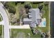 Overhead view of property with pool, lush lawn, and meticulous landscaping at 10628 Walnut Creek W Dr, Carmel, IN 46032