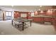Finished basement offers space for recreation and entertaining with the bar, exercise equipment and foosball table at 10628 Walnut Creek W Dr, Carmel, IN 46032
