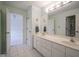 Bright bathroom with dual sink vanity and tile floors at 10628 Walnut Creek W Dr, Carmel, IN 46032
