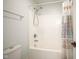 Clean white bath and shower combo with shower curtain at 10628 Walnut Creek W Dr, Carmel, IN 46032
