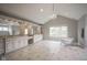 Spacious bathroom with vaulted ceiling, featuring a soaking tub, large vanity, and ample natural light at 10628 Walnut Creek W Dr, Carmel, IN 46032