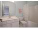 Bright bathroom with light blue walls, single sink vanity and shower and tub combo at 10628 Walnut Creek W Dr, Carmel, IN 46032