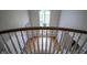 Elegant foyer with a view of a sparkling chandelier and large arched window, showcasing an open and inviting atmosphere at 10628 Walnut Creek W Dr, Carmel, IN 46032