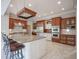 Spacious kitchen featuring a large island with granite countertop and stainless steel appliances at 10628 Walnut Creek W Dr, Carmel, IN 46032