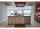 Kitchen island featuring a sink, dishwasher and stainless steel appliances at 10628 Walnut Creek W Dr, Carmel, IN 46032
