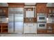 Kitchen with stainless steel refrigerator, double ovens, and ample counter space at 10628 Walnut Creek W Dr, Carmel, IN 46032