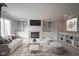 Bright living room featuring built-in shelves, a cozy fireplace, and stylish furnishings for comfortable living at 10628 Walnut Creek W Dr, Carmel, IN 46032