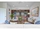 Inviting living room with built-in bookcase, hardwood floors, neutral furniture, and stylish decor at 10628 Walnut Creek W Dr, Carmel, IN 46032