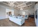 Spacious living room with hardwood floors, chandeliers and comfortable seating at 10628 Walnut Creek W Dr, Carmel, IN 46032
