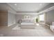 Serene main bedroom showcasing neutral tones, plush carpet, and stylish decor creating a tranquil and inviting atmosphere at 10628 Walnut Creek W Dr, Carmel, IN 46032