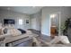 Spacious main bedroom offers wood floors, a bed with blue accents, and access to a private bathroom at 10628 Walnut Creek W Dr, Carmel, IN 46032