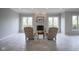 Sitting area with brick fireplace and views of nature at 10628 Walnut Creek W Dr, Carmel, IN 46032
