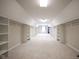 Spacious walk-in closet with carpeted floors and closet rod and shelving system at 10628 Walnut Creek W Dr, Carmel, IN 46032