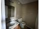 Modest bathroom with vanity, toilet, and mirrored wall at 11106 Wismar Dr, Indianapolis, IN 46235