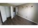 Bedroom with closet, wood-look floors, and bright window at 11106 Wismar Dr, Indianapolis, IN 46235