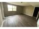 Spacious bedroom featuring updated flooring and a sunlit window at 11106 Wismar Dr, Indianapolis, IN 46235