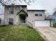 Charming two-story home features a front porch, attached garage, and pleasant curb appeal at 11106 Wismar Dr, Indianapolis, IN 46235